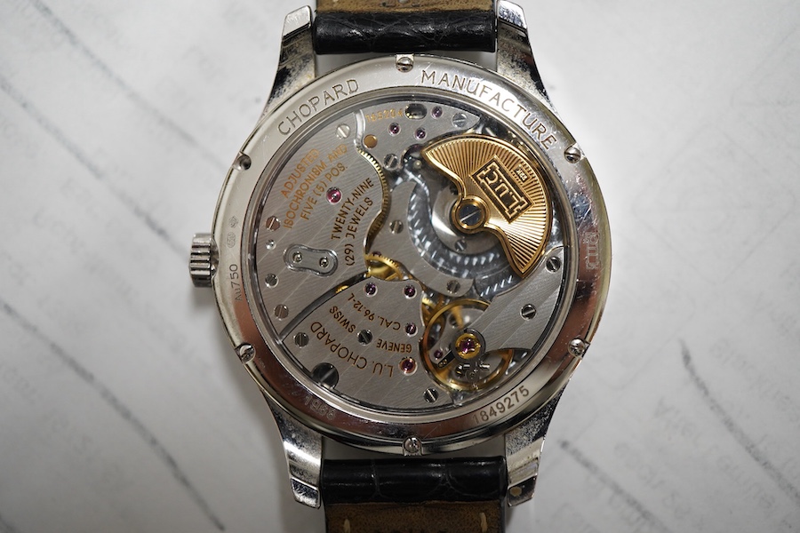 A gentleman's recent 18k white metal L.U. Chopard automatic chronometer wrist watch, with mother of pearl dial, diamond dot markers and subsidiary seconds, the bezel set with small brilliants, case diameter 35mm, movemen